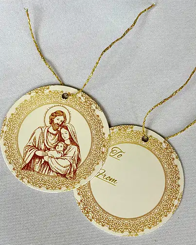Two round Golden Nativity gift tags on gold thread