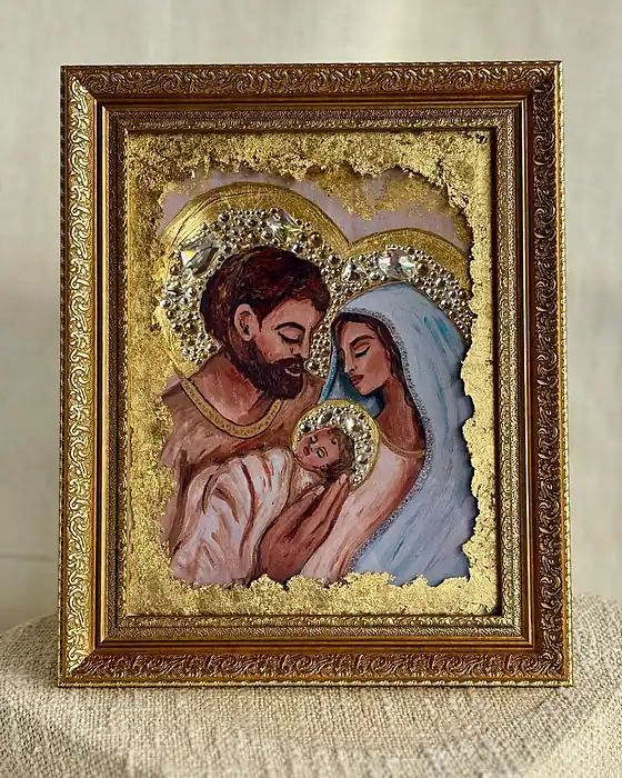 The O Night Divine print of the Holy Family in a large ornate gold frame